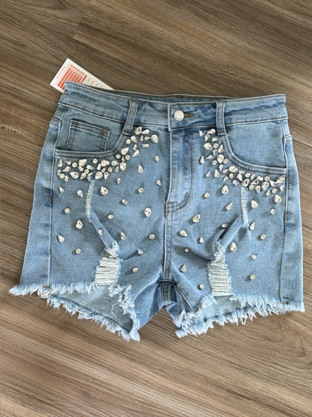 Women’s Light Blue Distressed Denim Shorts with Rhinestone Embellishment